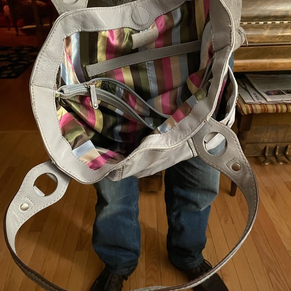 Great condition with clean divided interior. Has zippered compartments. - Picture 3 of 5